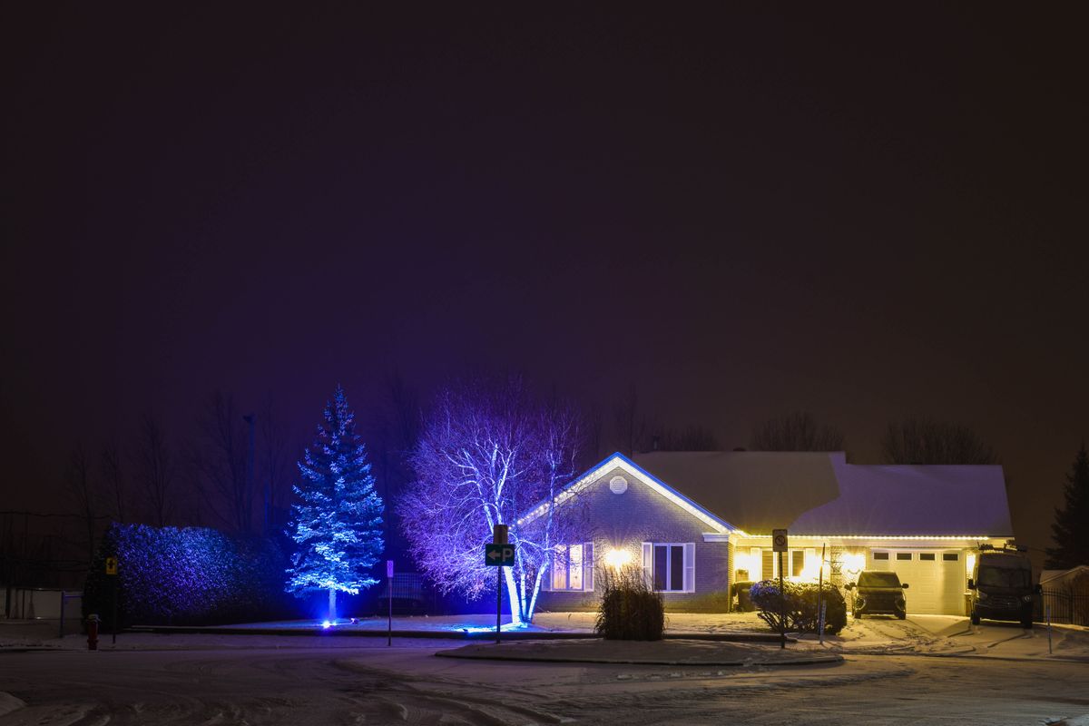 Professionally installed Christmas lights — Evening curb appeal — <b>Kansas City</b>